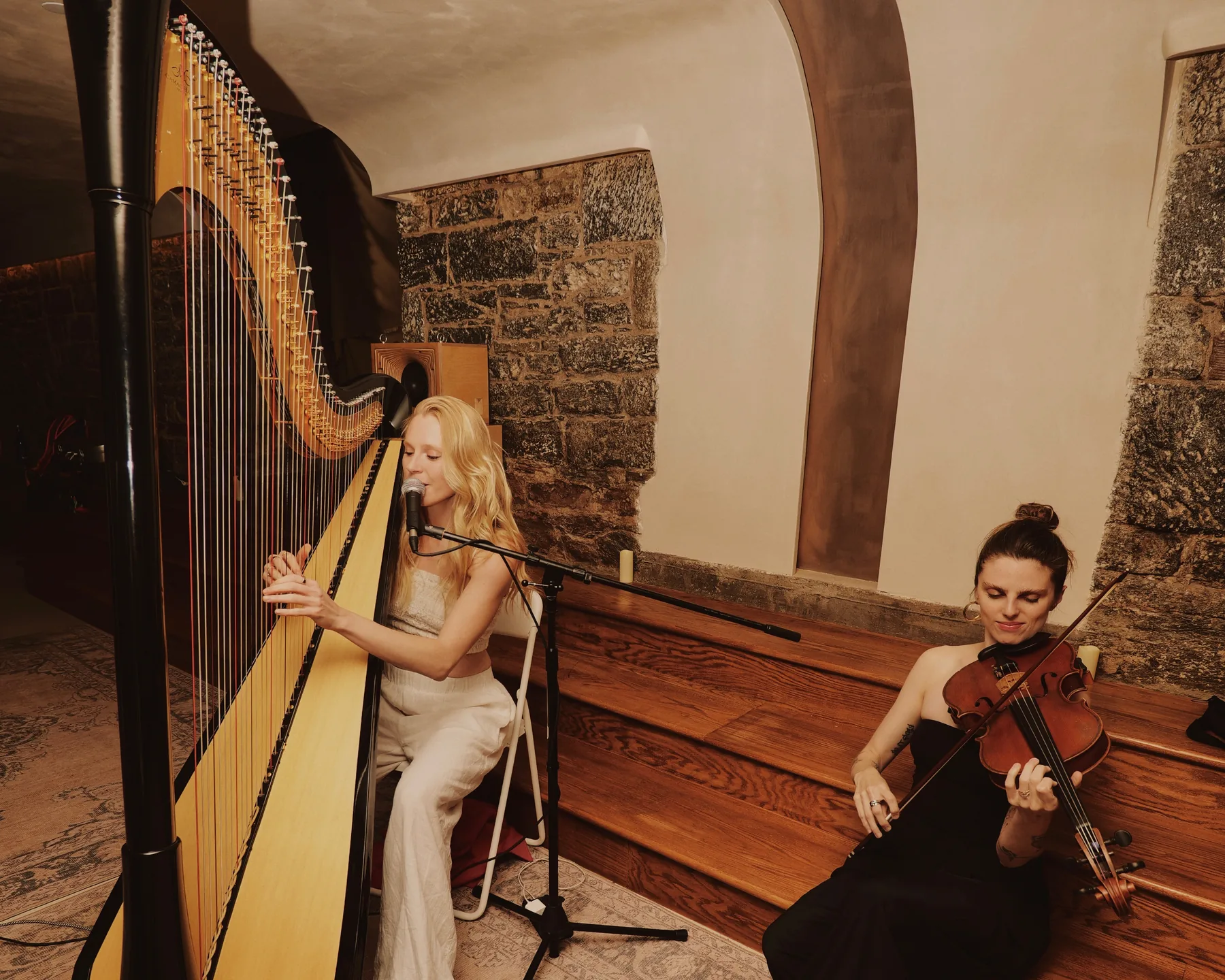 A harpist and violinist performing at Moonrise